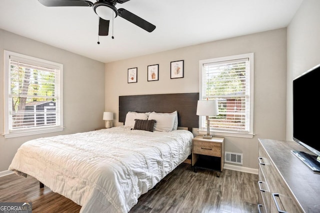 bedroom featuring dark hardwood / wood-style flooring and ceiling fan