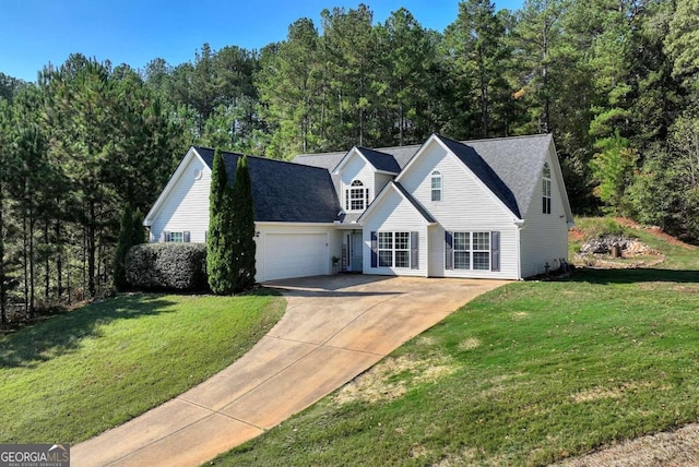 view of front of property with a garage and a front lawn