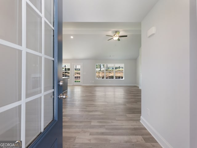 interior space featuring light wood-type flooring and ceiling fan