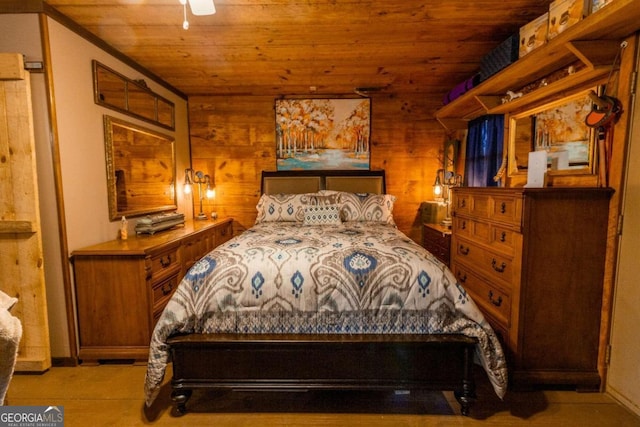 bedroom featuring wood ceiling, wooden walls, ceiling fan, and light tile patterned floors