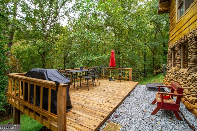 wooden terrace with area for grilling