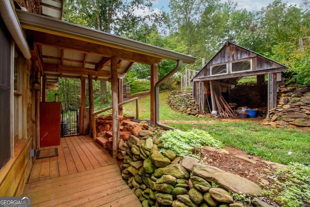 wooden deck featuring an outbuilding