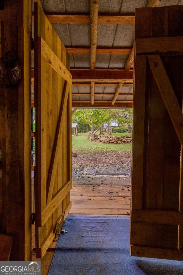 doorway to outside with wood-type flooring