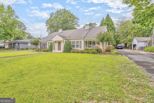 ranch-style home with a front yard