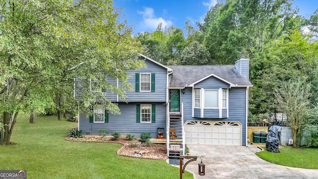 split level home featuring a front yard and a garage