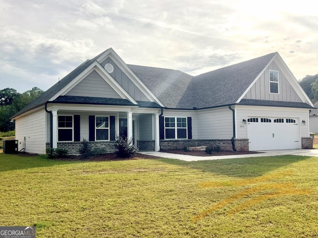 craftsman-style home with central AC unit and a front lawn