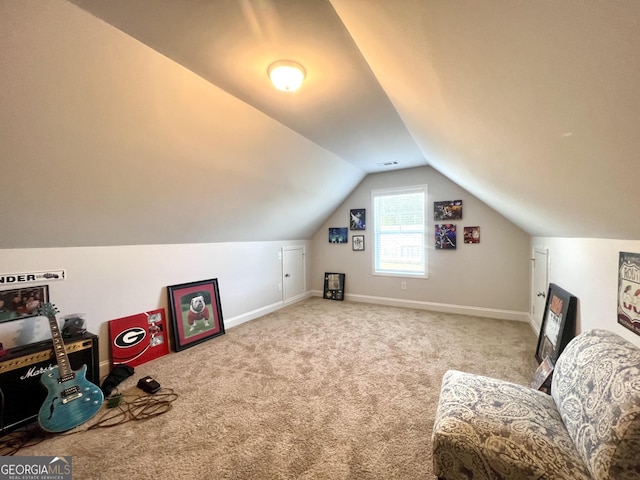 living area featuring lofted ceiling and carpet floors