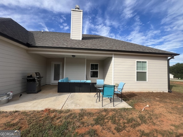 rear view of house featuring outdoor lounge area and a patio