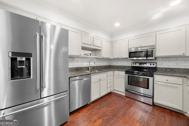 kitchen with white cabinetry, dark hardwood / wood-style flooring, sink, and stainless steel appliances