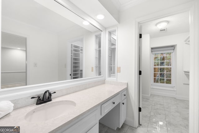 bathroom featuring vanity and ornamental molding