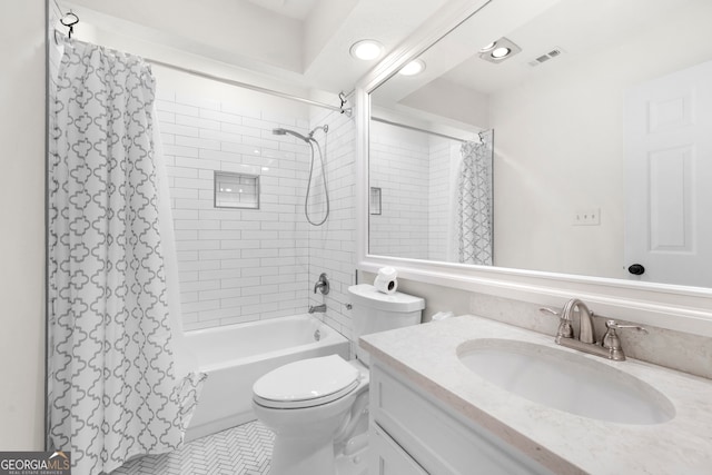 full bathroom with shower / bath combo with shower curtain, tile patterned flooring, vanity, and toilet