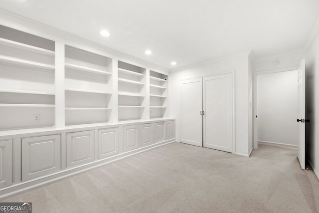 unfurnished bedroom featuring light carpet and ornamental molding