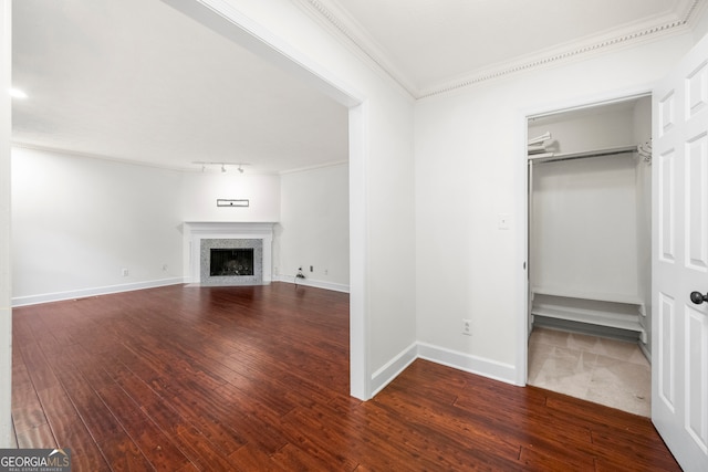 interior space with wood-type flooring and crown molding