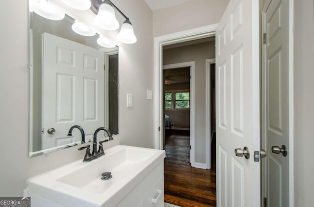 bathroom with vanity and hardwood / wood-style floors