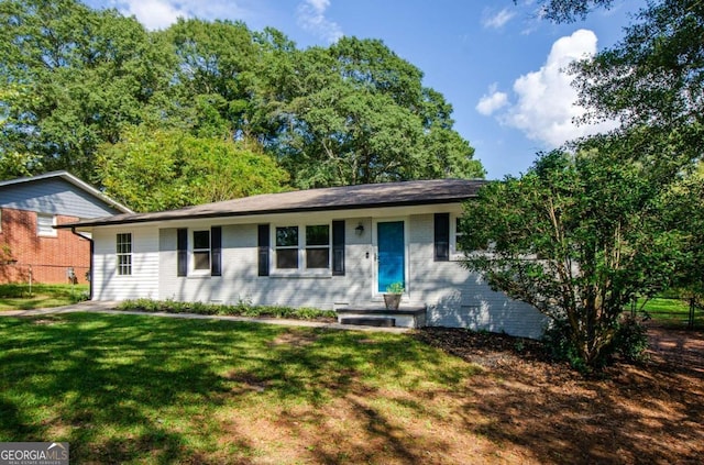 ranch-style house with a front yard