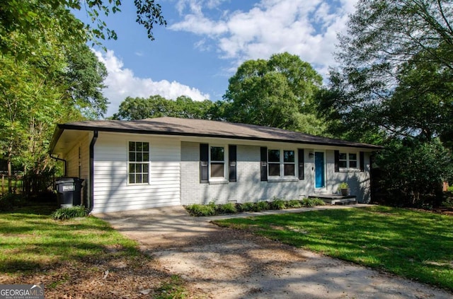 ranch-style house with a front lawn