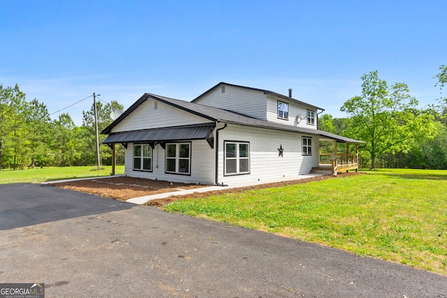 exterior space featuring a yard and a porch