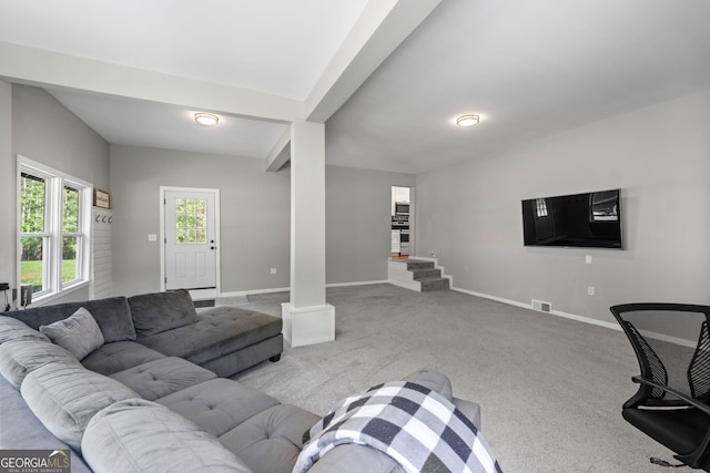 living room featuring visible vents, baseboards, and light colored carpet