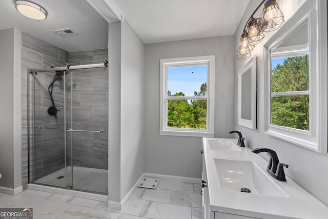 full bath with marble finish floor, visible vents, a sink, and baseboards