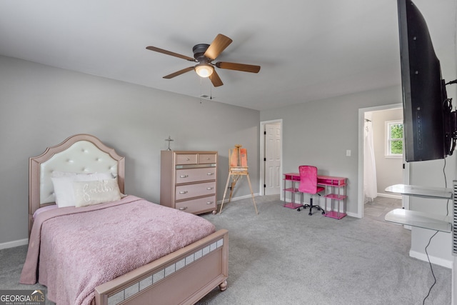 bedroom featuring light carpet, ceiling fan, and baseboards