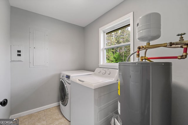 washroom with gas water heater, washing machine and dryer, laundry area, electric panel, and baseboards