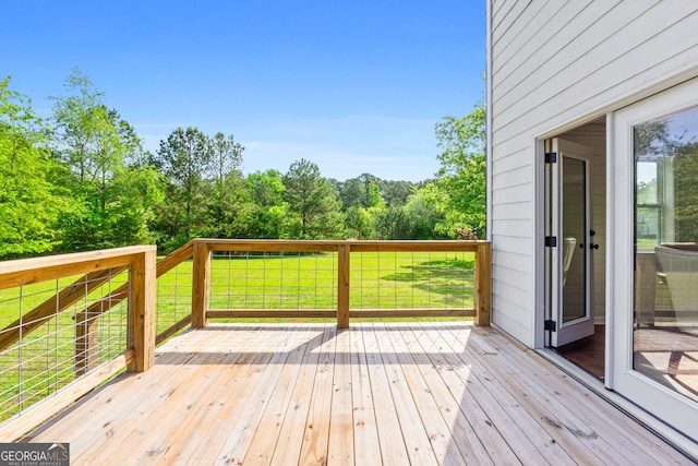 wooden deck with a yard