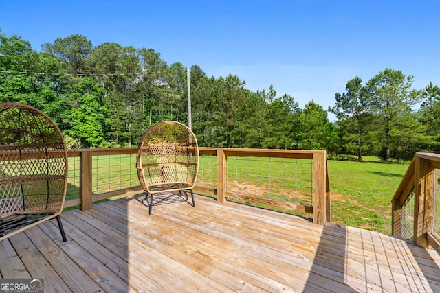 wooden deck with a lawn