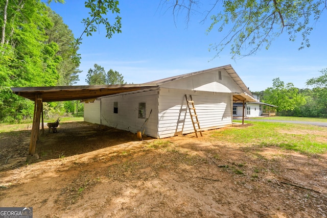 view of home's exterior featuring a carport