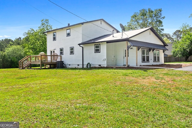 exterior space with a deck, a yard, crawl space, and fence