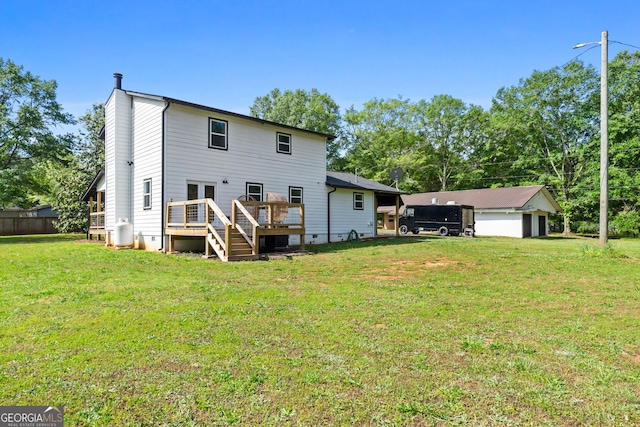 rear view of house featuring crawl space, a lawn, and a wooden deck