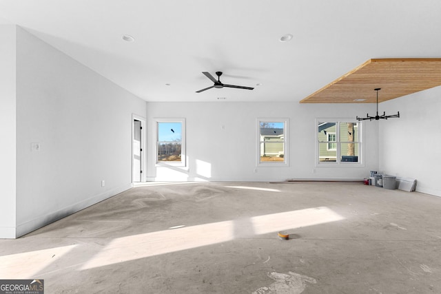 unfurnished living room with ceiling fan