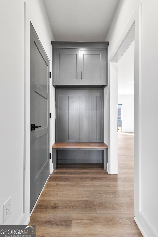 mudroom with light wood finished floors