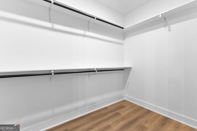 spacious closet with wood finished floors