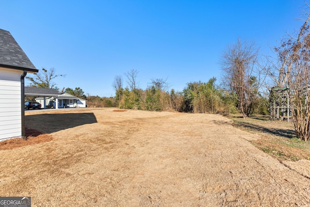 view of yard with a carport