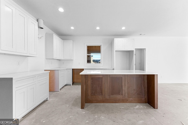 kitchen featuring white cabinets and a center island