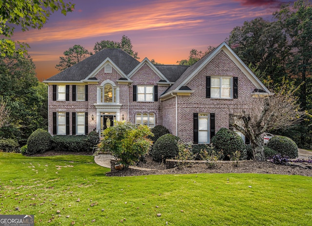 view of front of property with a lawn