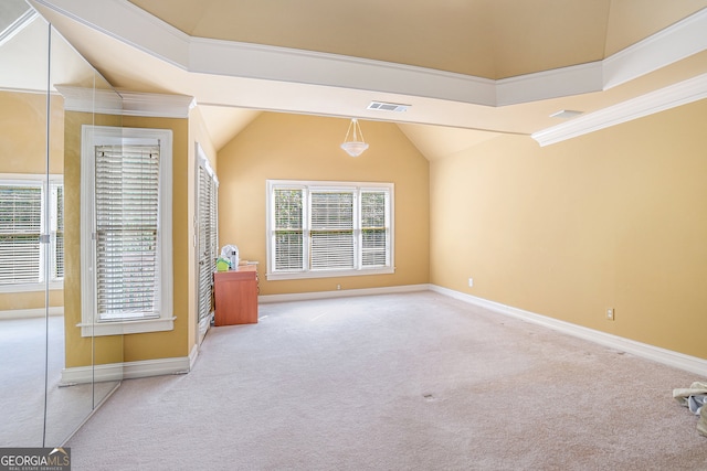 interior space featuring light colored carpet and vaulted ceiling