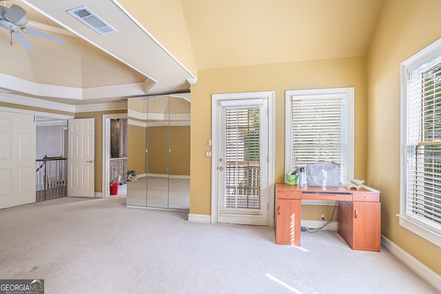 carpeted office with lofted ceiling, ceiling fan, and crown molding