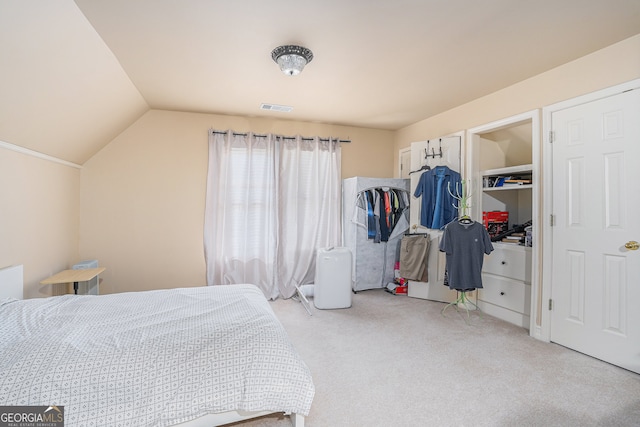 bedroom with vaulted ceiling and light carpet