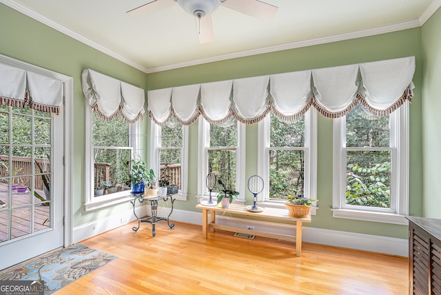 sunroom featuring ceiling fan