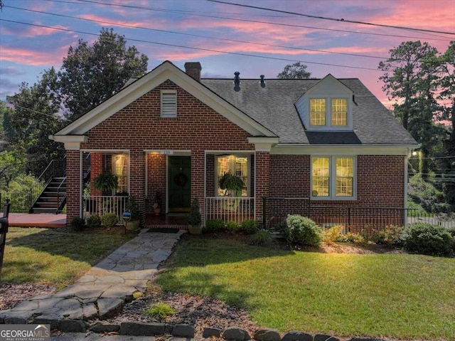 view of front of house with a lawn