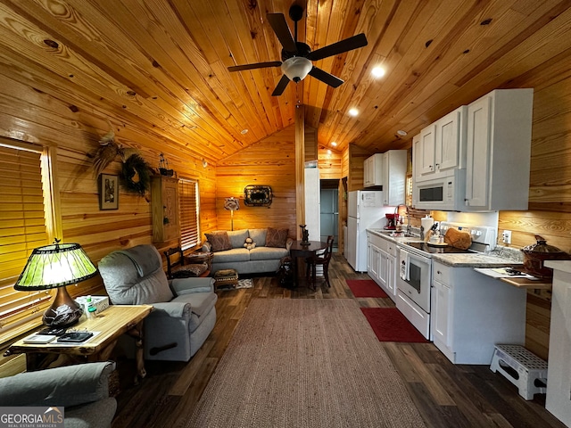 kitchen with dark hardwood / wood-style floors, lofted ceiling, white cabinetry, white appliances, and ceiling fan