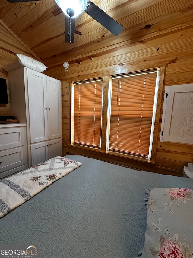 unfurnished bedroom featuring wood ceiling, wooden walls, and ceiling fan