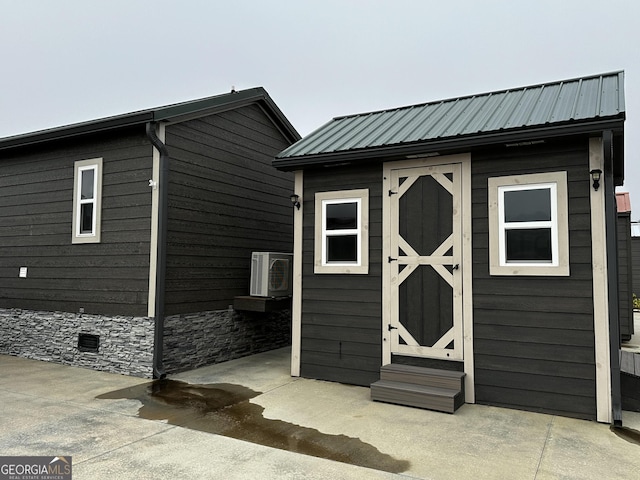 view of shed featuring ac unit