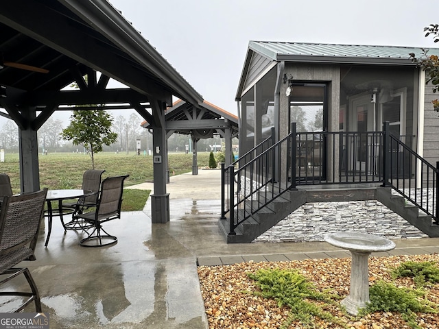 view of patio with a gazebo and outdoor dining space