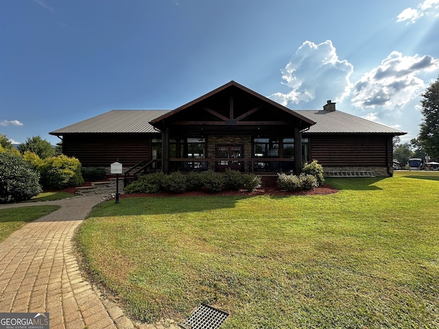 view of front of property with a porch and a front lawn