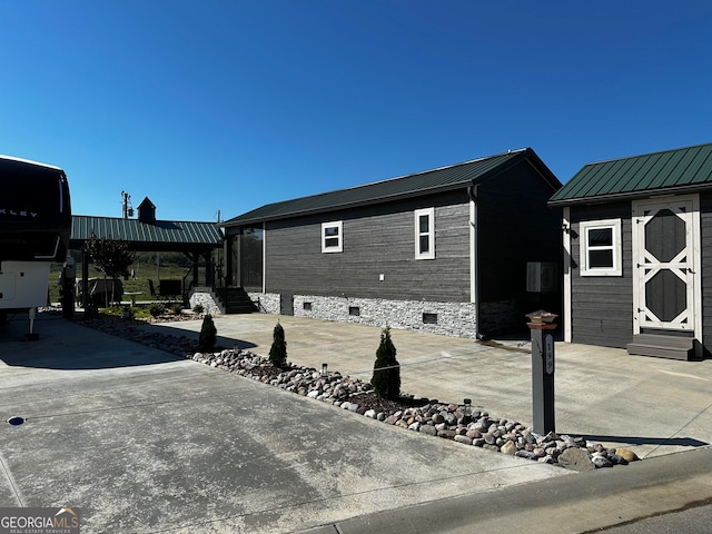 exterior space with a shed