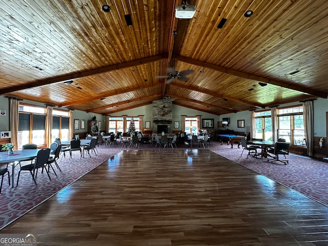 unfurnished dining area with wood ceiling, a wealth of natural light, and beamed ceiling