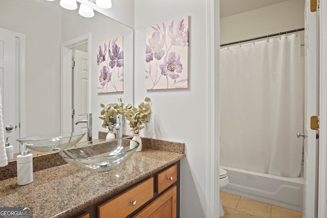 full bathroom with vanity, shower / bath combo with shower curtain, toilet, and tile patterned floors