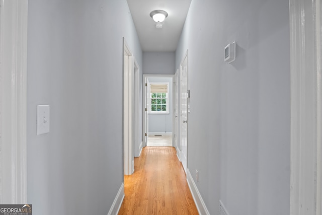 corridor featuring light hardwood / wood-style floors